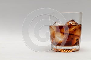 A close up in a glass of cold cola