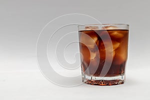 A close up in a glass of cold cola