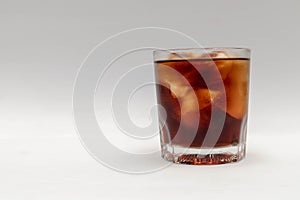 A close up in a glass of cold cola