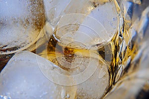 A close-up of a glass filled with whiskey