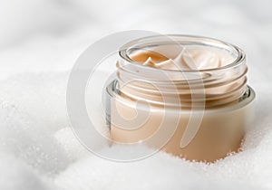 Close up Glass jar with beige cream