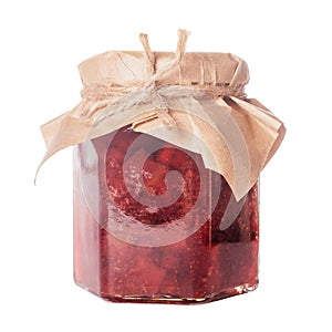 Close-up of glass jar full of delicious lingonberry pear jam with lid wrapped in beige craft paper on white background.