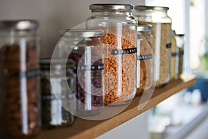 Close Up Of  Glass Jars On Shelf Being Reused To Store Dried Food Living Sustainable Lifestyle At Home