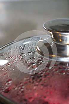 Close-up glass lid with condensate drops