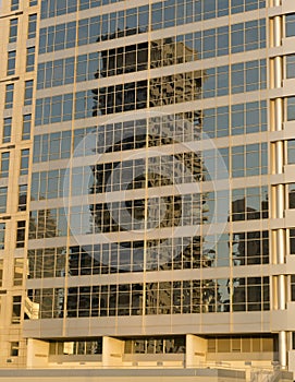 Close-up of the glass office building with reflections and sunflare effect