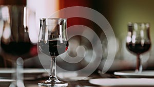 Close-up of a glass of red wine on the dining table