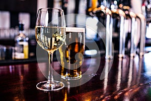 Close up of a glass of wine and a beer