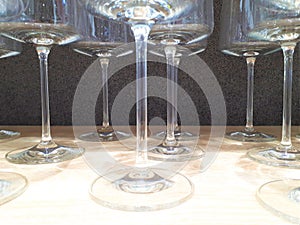 Close-up of glassware with bokeh effect, decorative and festive glasses of various shapes and sizes.