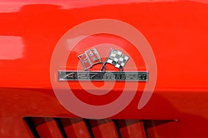 Close-up of a glossy red Chevrolet Corvette car in Manchester, the United States