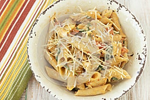 Close Up Gluten Free Penne Pasta With Cheese In Rustic Bowl