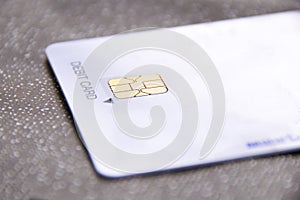 Close up Gold Chip cards on white Debit card photo
