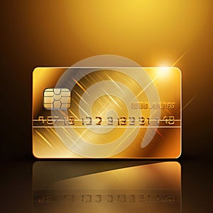 close-up gold credit card on a dark background