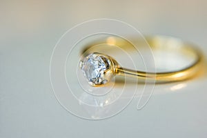 Close-up of a gold engagement ring.