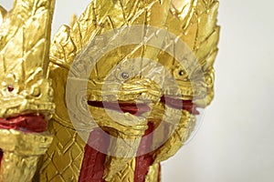 Close up gold Naka in temple. art of ancient in Buddhist.