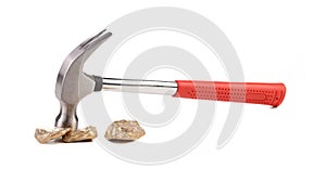 Close up of gold nugget and hammer.