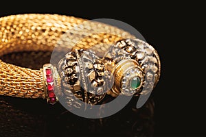 Close up of golden bangle with many diamonds