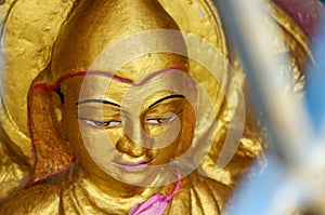 Close up from a golden Buddhist statue