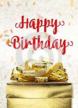 Close up Golden present box with Happy Birthday word and confetti blur background