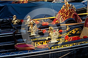 Close up of golden seahorses details on a gondola in Venice, Italy