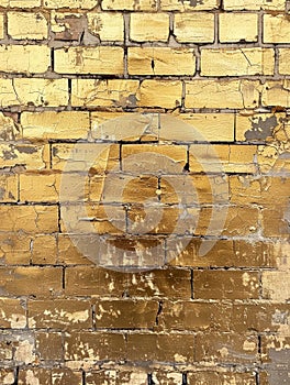 Close-up of golden-tinted tiles with a reflective sheen, the texture evokes a sense of luxury and opulence. Light plays