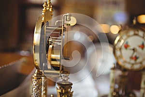 Close-up of golden watch on table