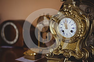 Close-up of golden watch on table