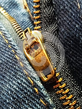 Close up, Golden zipper on blue jeans