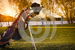 Close up of golf bag during sunset.