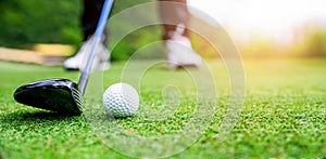 Close up golf ball on green grass field