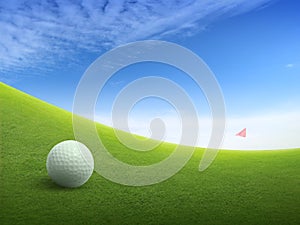 Close up golf ball on green grass field and red golf flag on green fairway with beautiful blue sky