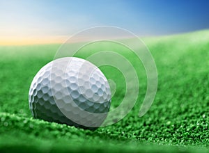 Close up of golf ball on green tee