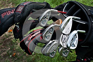 A close up of golf clubs