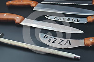 Close up of good set of kitchen knives for slicing. Set of steel kitchen knives