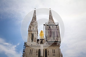 Close up on the gothic clocktower of Zagrebacka Katedrala, or Zagreb cathedral, in afternoon from Kaptol district.