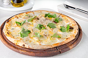 Close up gourmet pizza with gorgonzola and porcini white mushrooms