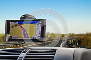 Close-up of gps navigation system device in travelling car