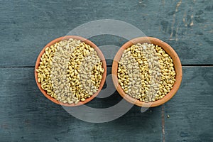 close up of grains and wheat ears on white background