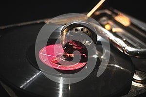 Close-up of a gramophone needle playing a vinyl music record