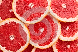 Close-up Grapefruit slices abstract background in Living Coral color