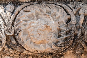 Close up of grapes carving at the ruins of Capernaum in Israel.