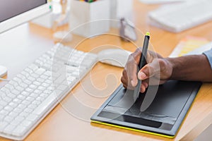 Close up of a graphic designer using graphics tablet