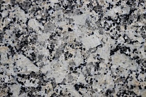 Close-up of a gray granite slab containing quartz, feldspar, and mica