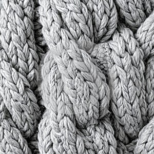Close Up of Gray Knitted Wool Pattern Background Texture Full Frame