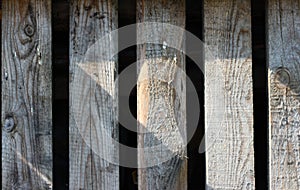 Close up of gray wooden fence panels