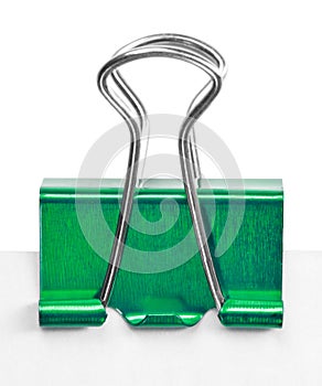 Close up of a green binder clip