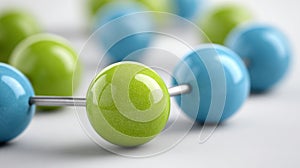 Close-up of green and blue molecular structure spheres.