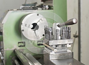 Close up green lathe machine in factory