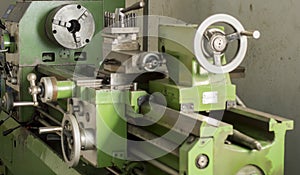 Close up green lathe machine in factory