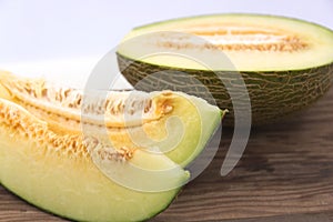 Close-up of a green melon cut into several slices