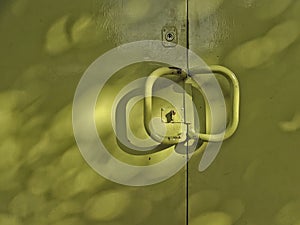 Close-up of Green Metallic Garage Door in the Street